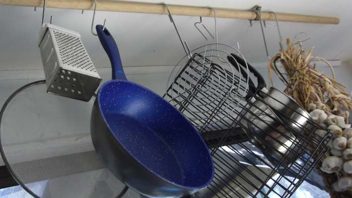 Anything with a hole in it can be suspended on hooks in your off grid kitchen
