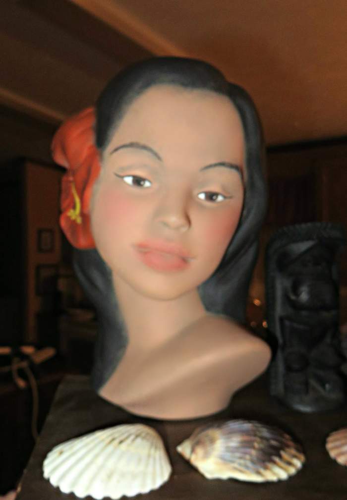 She is about eight inches tall, and is much like the Marwai type Polynesian busts of that era. She is made of fine porcelain and there are no chips or cracks.