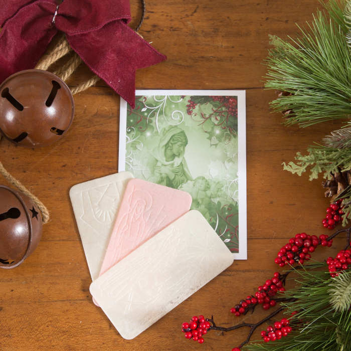 Oplatek - An Envelope Open for Sharing including the Traditional Pink Wafer Offered to Farm Animals, If Any.