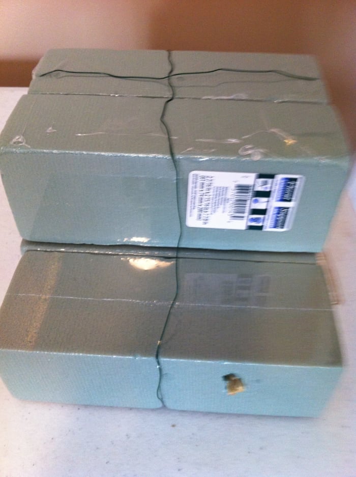 Hot glue and wire to secure the blocks. Also I used some long stems which helped to secure the block.