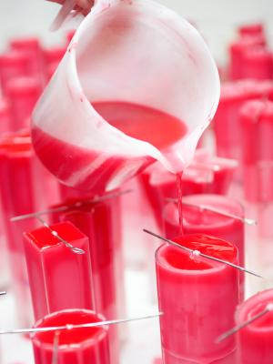 Pouring wax into plastic molds
