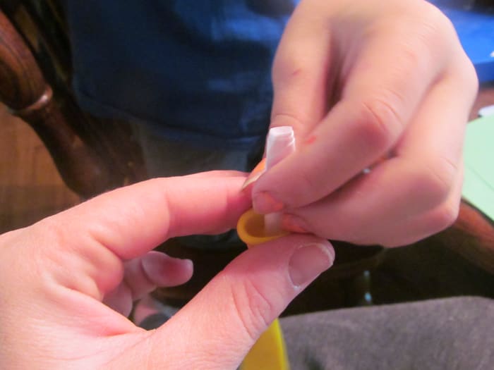 Tightly roll the card up and place in into the balloon that is NOT rolled up. You may need to shake the balloon a bit.