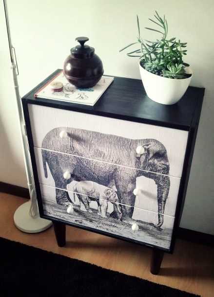 This piece of furniture started life as a plain IKEA product, but decoupaging a picture to the front has made it unique.