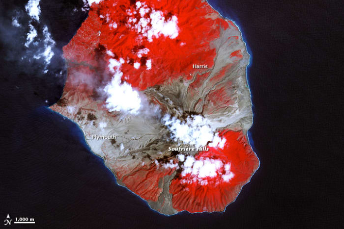 Southern half of Montserrat on March 17, 2007. Red: vegetated. White: clouds. Blue/black: ocean water. Gray: covered by flow deposits.