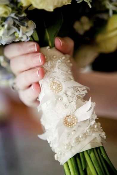 A simple bouquet wrapped with a lace wrap decorated with gems is a graceful touch to your lace wedding