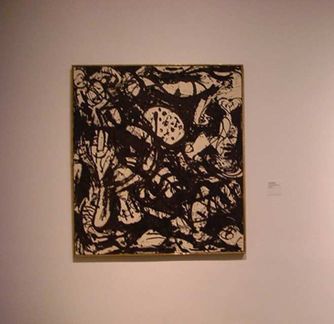 This Jackson Pollack, perfectly paired with a simple black frame, would suit your modern living room.