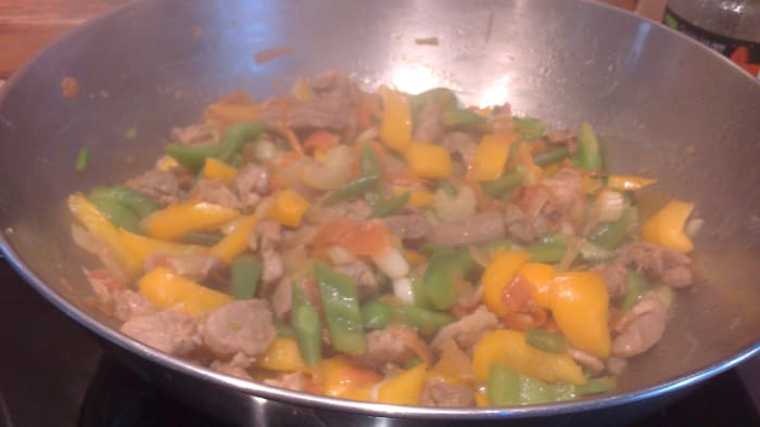 Pork Stir Fry with yellow and green capsicum or bell pepper and carrots, different ingredients