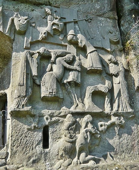 The medieval relief carving on the face of Externsteine titled "the Descent from the Cross." Below the cross stands a withered tree said represent the Irminsul.