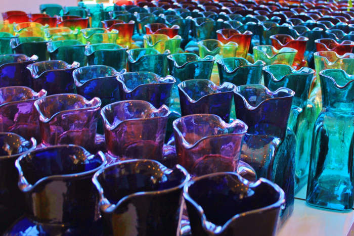 Blenko water bottles are reasonably priced, many at less than $20. Pictured: an array of carafes in the Blenko gift shop.
