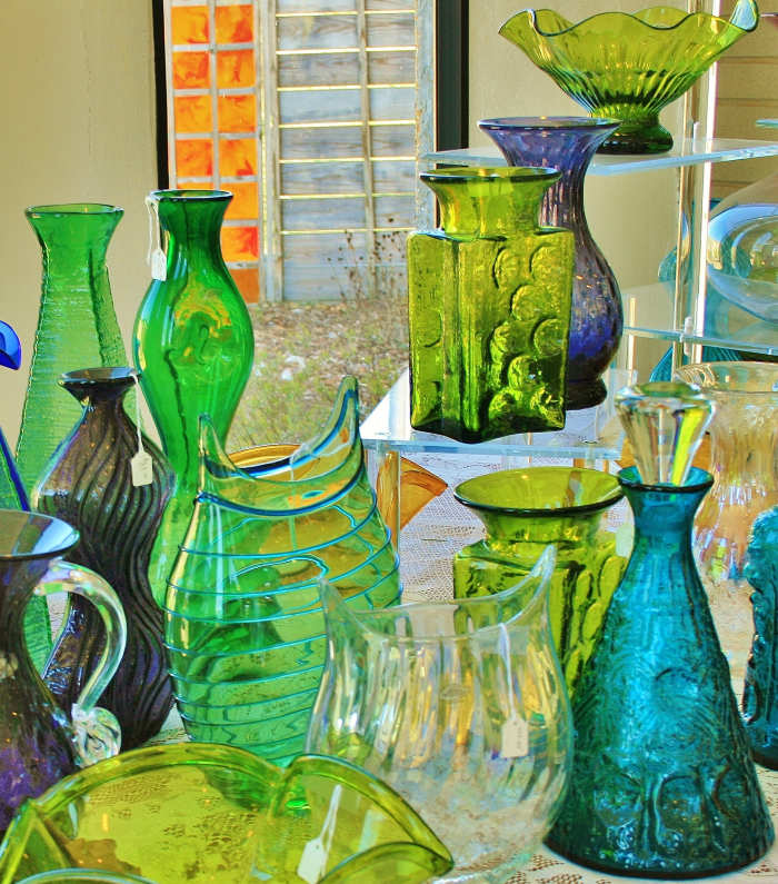 Another shot of a gorgeous display in the gift shop. Notice the aqua decanter. While the decanter itself is hand blown, the stopper is pressed.