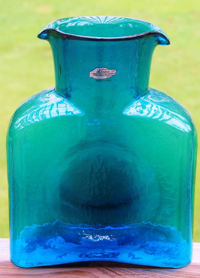 This contemporary Blenko water jug bears the silver hand sticker on a transparent background. Notice the slight unevenness of the thick rim.