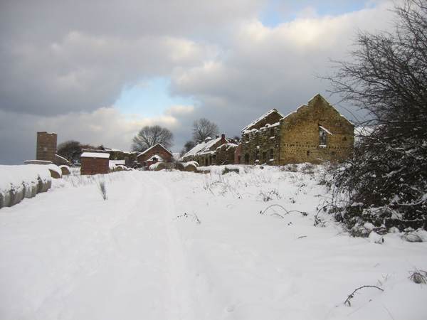 Abandoned, sorry-looking Slapewath buildings stand in winter snow awaiting an uncertain future