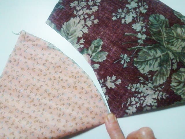 Each piece has been folded in half, raw edges of each piece matching with itself. I press the fabric with my finger to create a crease that I will use as a reference point when pin basting the two fabrics together.