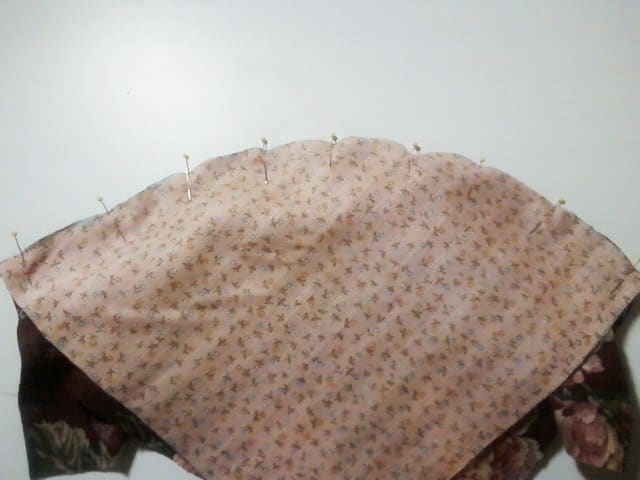 I put pins every few inches working from the center toward the outer edges and smoothing the fabric with my fingers as I work.
