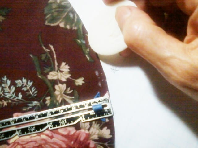 Since I have a paper template without seam allowance, I have to mark my cutting line 1/4" away from the edge of the template. Soap is used to mark the dark fabric.