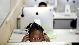 Third grader Iyana Simmons on coding exercise. Coding is important in computer programming.