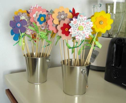 Paper and felt / fabric flowers are simple, affordable, and cheerful.