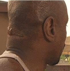 A screenshot from the 2001 film "Baby Boy" in which actor Ving Rhames reveals the actual scar on his neck