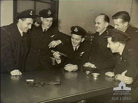 Group portrait of crew members of No. 466 Squadron. Left to right: Pilot Officer PO William Edmond Eagleton; PO Leslie Dean Anderson; PO Darrell William Cuthbert; Flt Lt Wilfred Guy Baldwin; PO John Devenish Chapman; Flt Lt Colin Osborne Chapman