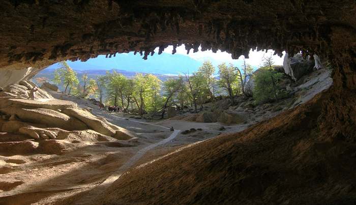 Cueva del Milodon entrance from inside. A life-sized statue of Mylodon stands to the far left.
