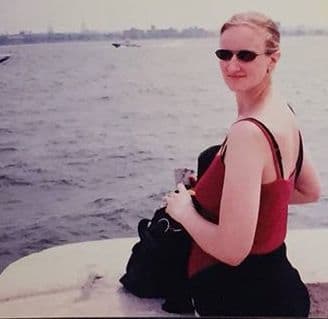 The author in 1998, on the ferry to Ellis Island. The trip to New York was funded by my law firm. People told me I should "get rid of it" so I wouldn't ruin my figure.
