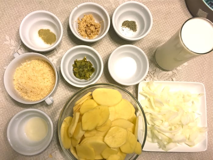 All ingredients: thyme, salt, potatoes, parmesan cheese, onions, jalepenos, heavy cream, garlic, chicken base