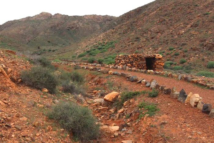 An attractive path to walk through the hills near the little village of Toto in Central Fuerteventura. A little stone hut provides shelter, and bottles of water are provided to quench the thirst of anyone who passes by