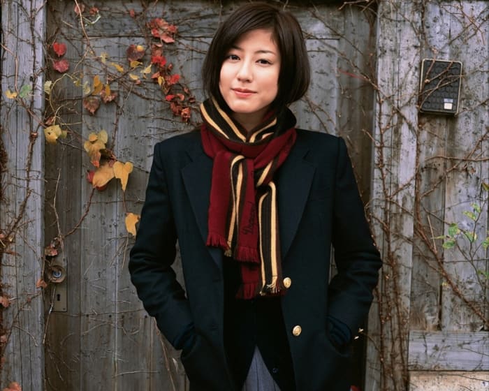 Supermodel Yumi Sugimoto of Osaka is seen here dressed in a very business like Japanese style uniform. This is one of the things that these models are required to do.