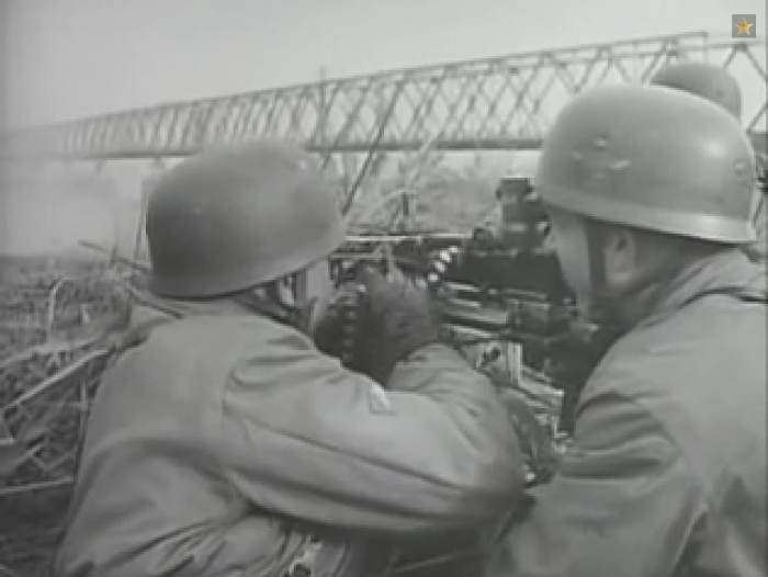 German paratroopers man a machine gun position near the drop zone. Their commander was Kurt Student, who planned the German drop on Crete in 1941