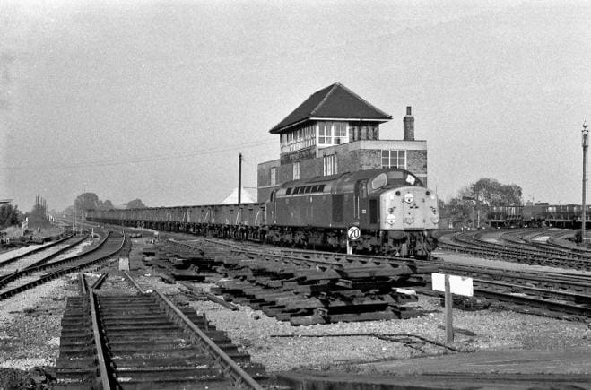 Rationalisation of the junction in 1970 - English Electric D252 passes Northallerton's signal box southbound with a train of BR 16 ton mineral wagons. There's something essentially British about the design of these two diesel locomotives... unlike...