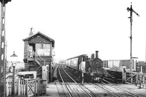Picton in the closing year of the branch (1954). The signalman takes the single line token from the driver of a Class G5 0-4-4 tank locomotive on its way into Picton's Down platform, back to Stockton-on-Tees. Stockton mpd (51E) had five of the class