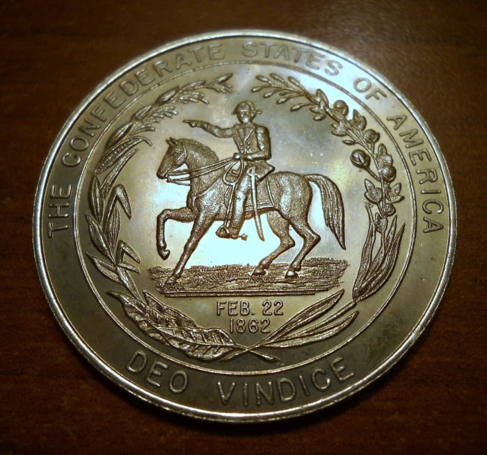 A 1862 Confederate Fifty Cents Coin, God will prove us right. Deo Vindice (motto of the Confederate States of America) "God Will Vindicate"