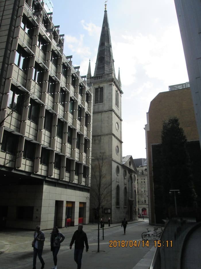 Between office blocks and shops is the church of St Margaret Patten. You see the tower at an oblique angle before the rest of the building comes into view...