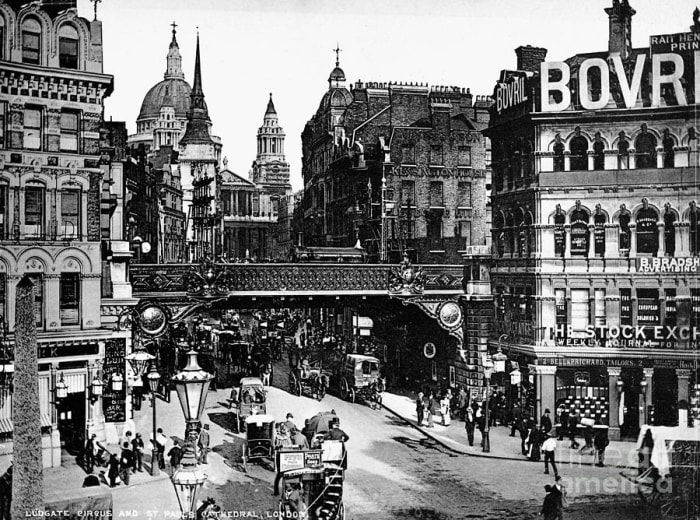 From around the same place, St Paul's nestles behind office buildings and shops at the top of Ludgate Hill where old St Paul's stood until 1666. The railway bridge in Granger's pre-WWI photo took the line from Blackfriars to Holborn Viaduct Station