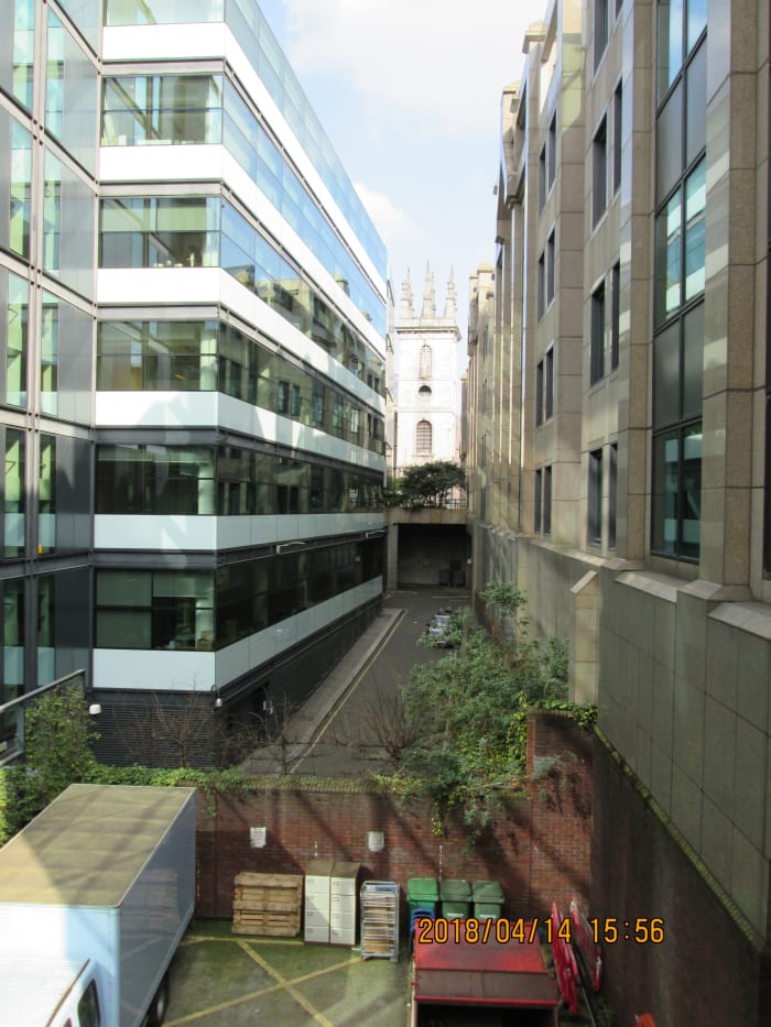 Between towers of steel, glass and concrete we catch another glimpse of the tower of St Mary Somerset