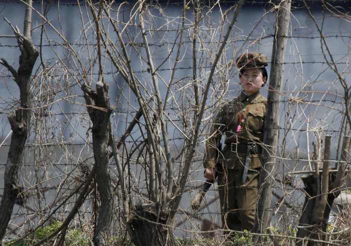 A North Korean guard stands watch over a concentration camp that does not officially exist.
