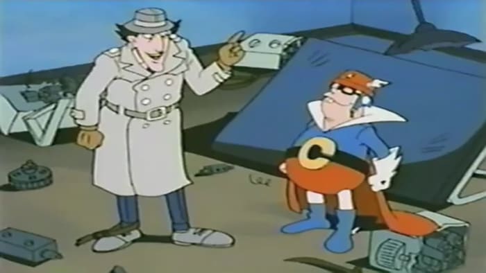 Inspector Gadget (left) stands with his personal assistant Corporal Capeman after they were saved from being hurt because of the dog Brain.