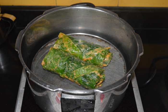 Step four: Cook the rolls by steaming for 20 minutes. I used a pressure cooker for this purpose. Don't put the cooker weight. Half-way through, turn taro rolls for uniform cooking.