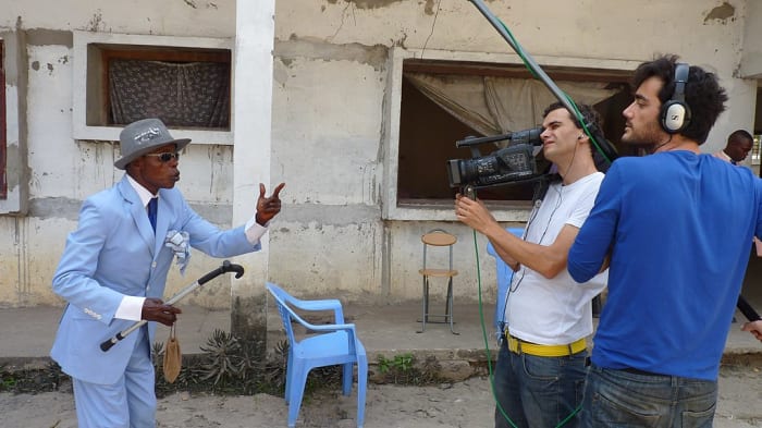 Sapeurs love publicity; here a member of the stylish community in Brazzaville is interviewed by Spanish television.