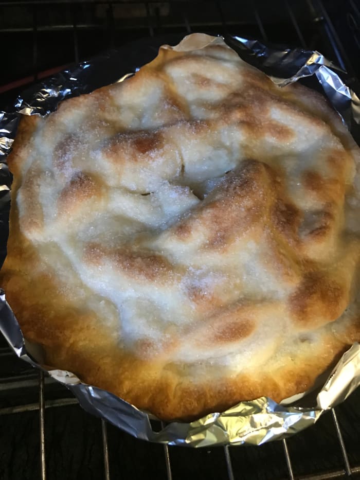 Bake for 20 minutes, then cover the edges of the crust with strips of foil to prevent them from becoming too dark. Bake for an additional 25 minutes.