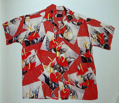 near perfect example of vintage shirt: wooden buttons, matched pocket, long collar, and bold pattern on hefty rayon. photo courtesy of Tommy Steele's Hawaiian Shirt Book.