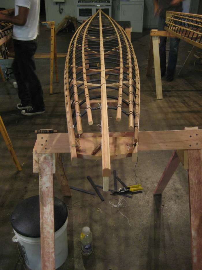 Fairing the boat - is the keel straight? Longs and gunnels symmetrical? Does it "look right"? This baidarka is a popular design originally from the Siberia/Bering sea area; it is a good long-distance kayak and not bad for novice paddlers.