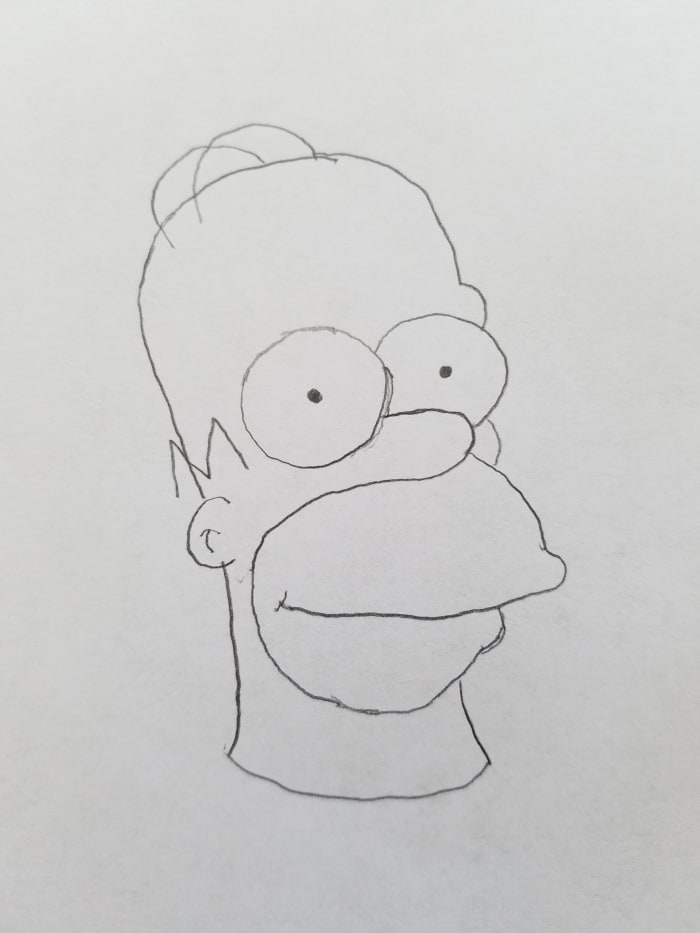 A penciled rough sketch of our Bootleg Homer Simpson is perfect for what we need to make it stand out. Take another pencil and add wacky things to your bootleg homer. Make his hair float or his eyeballs look like a flies eyes. Add whatever you want.