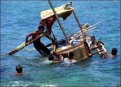 SOME CUBANS ODDLY ENOUGH WANTED TO LEAVE THE SOCIALIST PARADISE AND SAIL ACROSS SHARK INFESTED WATERS TO THAT EVIL CAPITALIST NATION CALLED AMERICA