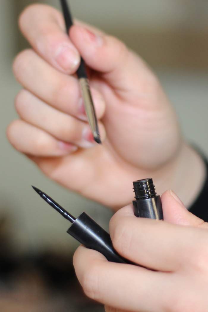 An angled brush and liquid eyeliner.