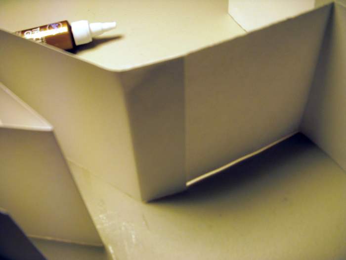 Back view shows how the strips attach. Continue until all strips are attached, making one continuous strip of accordian-folded paper.