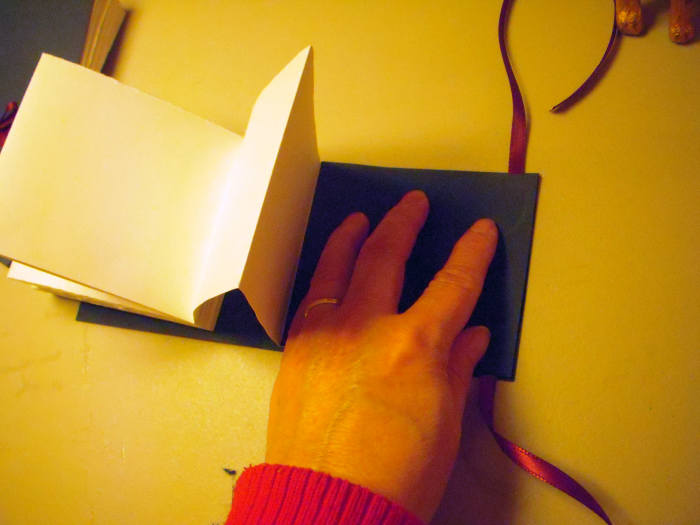 Press and hold until glue sets a bit, or apply a weight to hold the two pieces together until dry.