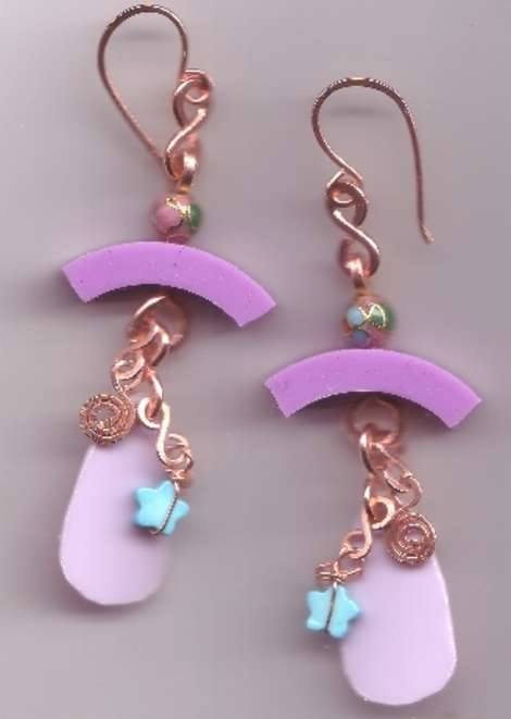 A little bit of plastic, a rubber ring from a Target Pharmacy bottle, a little stone star and some copper trim and you're good to go.