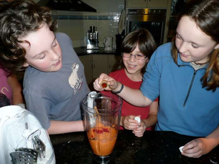 Using food coloring to simulate bile from the gallbladder to break down the fat from our food.