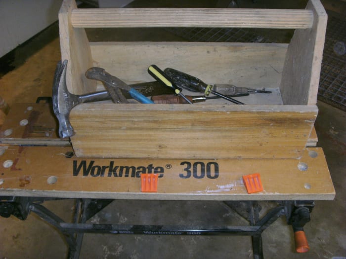 Toolbox made by cub scouts and used for 30 years. Note the Workmate workbench it is sitting on.